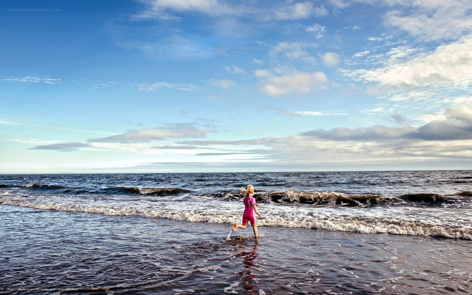 Child running on the beach