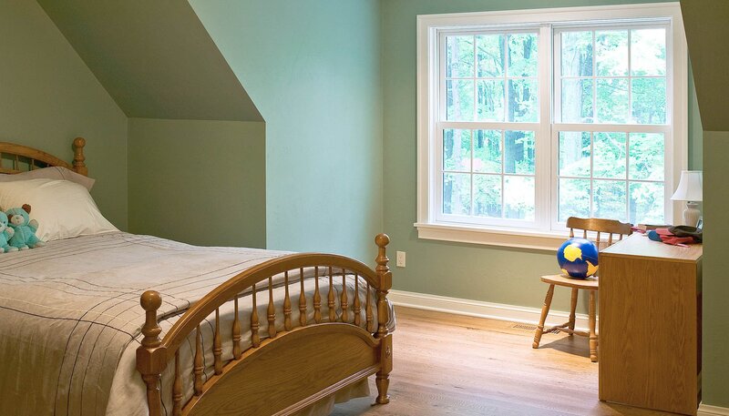 child's bedroom with bed and window