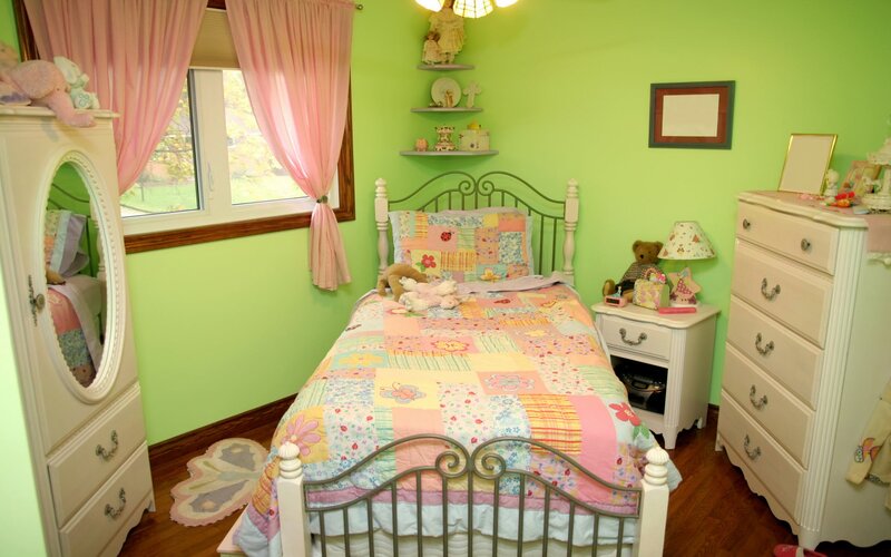 child's bedroom with green walls