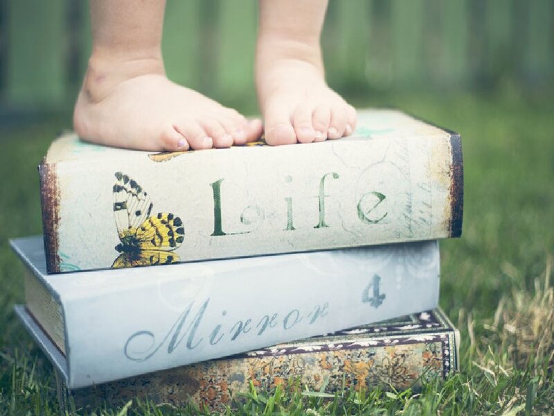 Child's Feet on Books