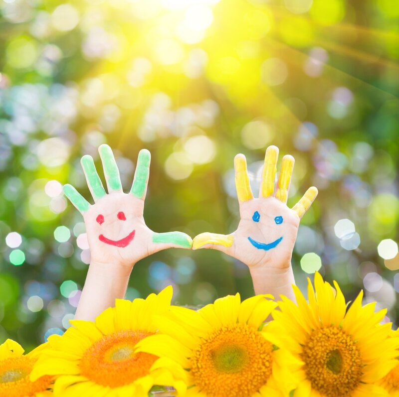 Child's Hands with Painted Faces