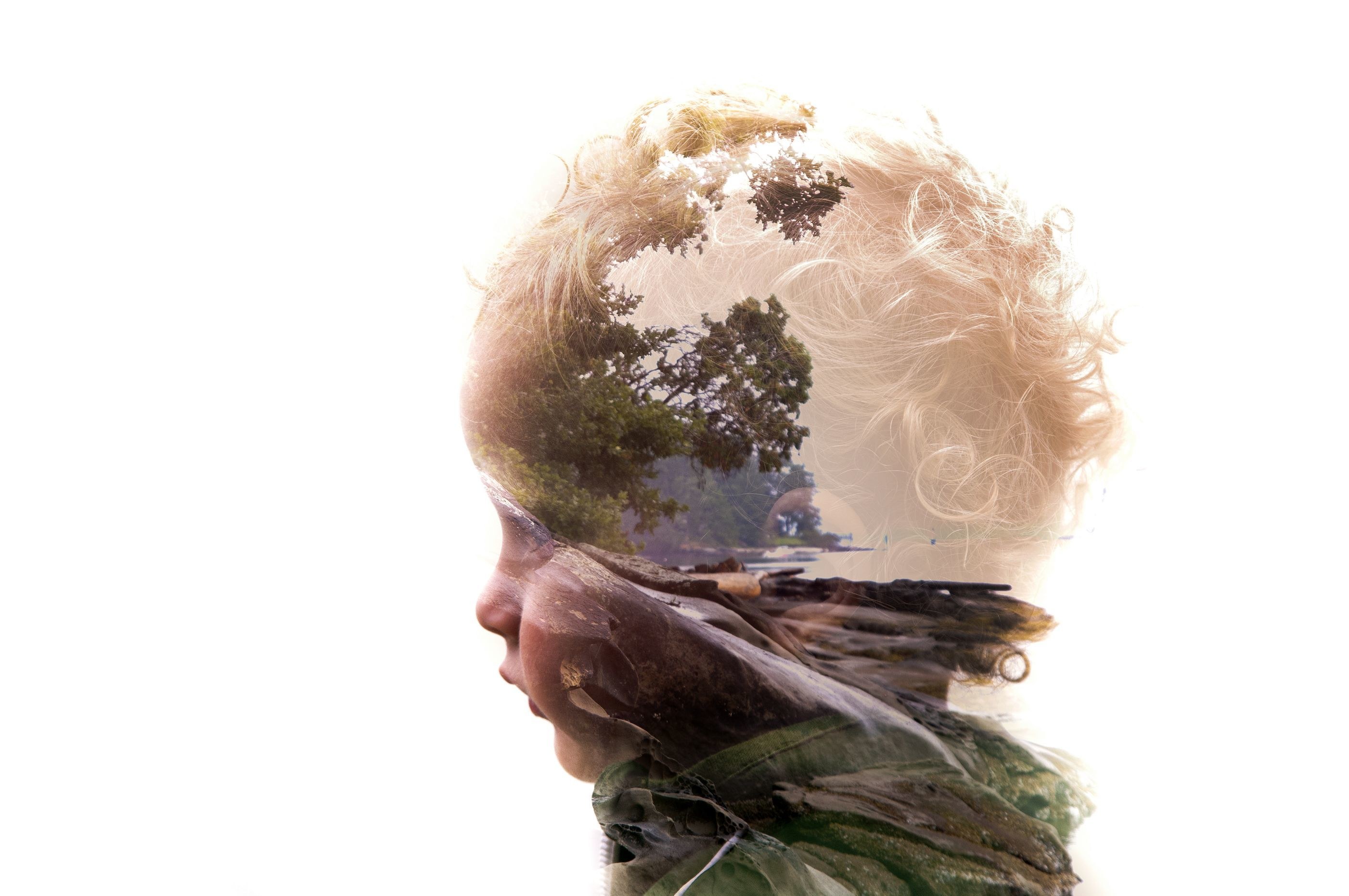 child's profile with nature overlay