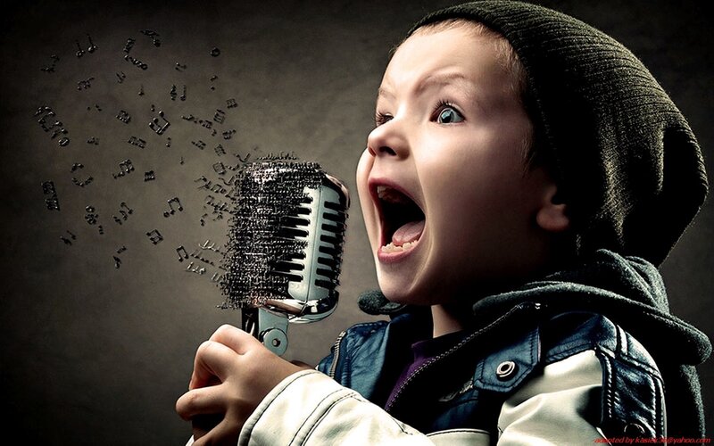 child singing into microphone