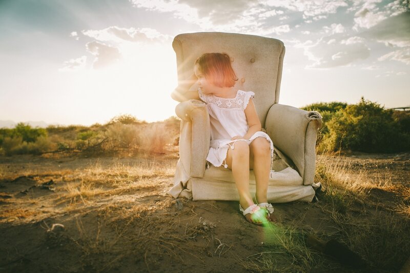 Child Sitting in Armchair