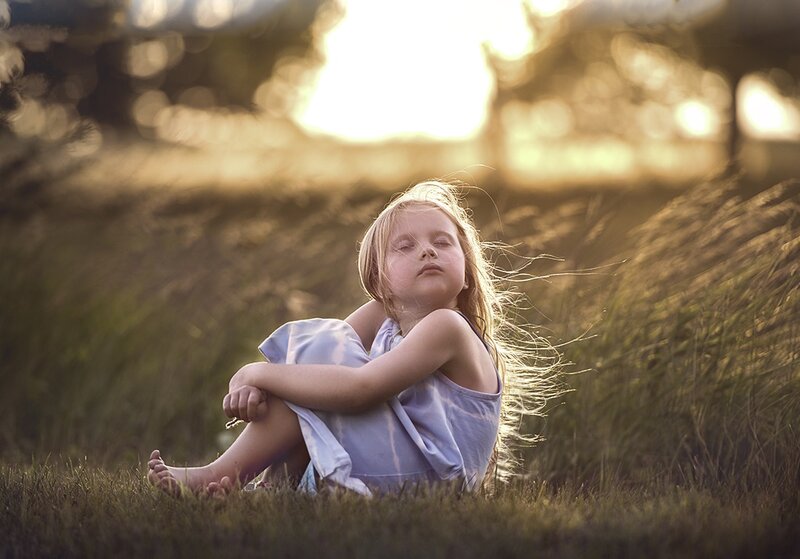 Child Sitting in Grass — Green