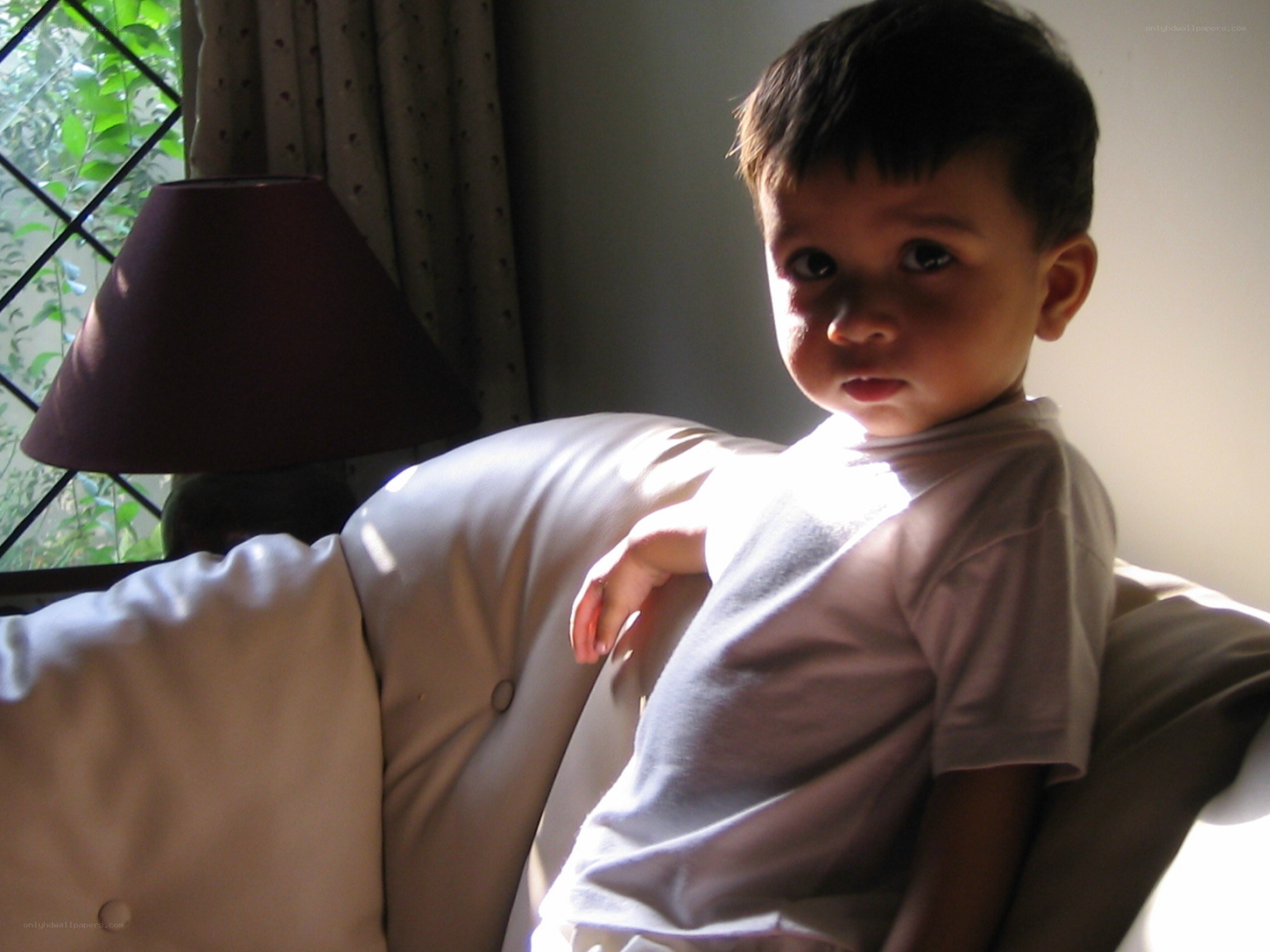 child sitting on a couch