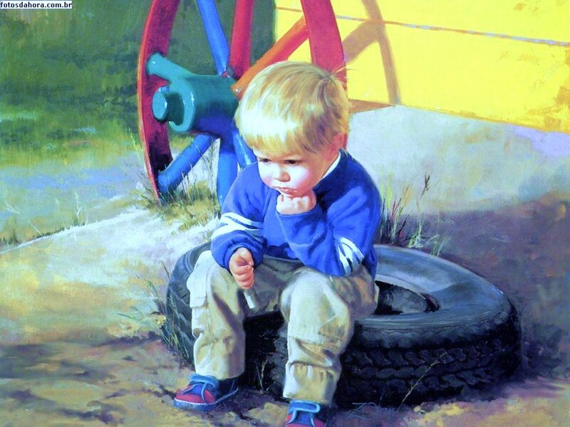 Child sitting on a tire
