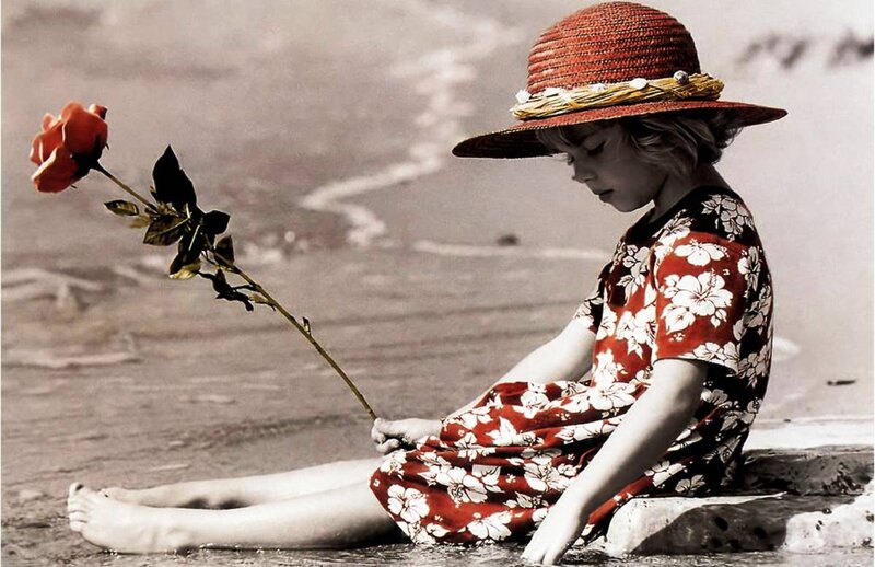 Child Sitting on Beach — Red