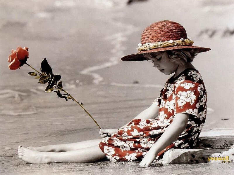 Child Sitting on Beach