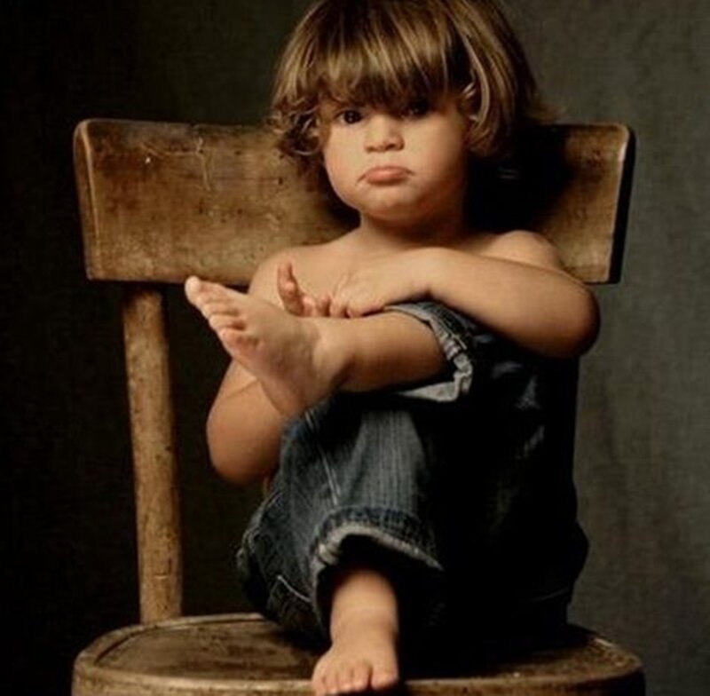 Child Sitting on Chair — Brown