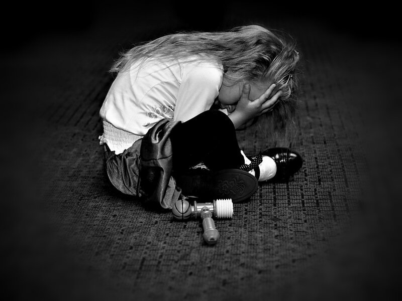 Child Sitting on Floor