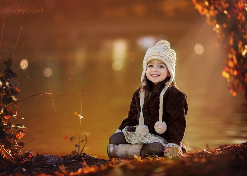 Child Sitting on Ground — Brown, Serene