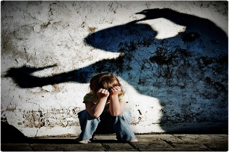 Child Sitting on Ground — White