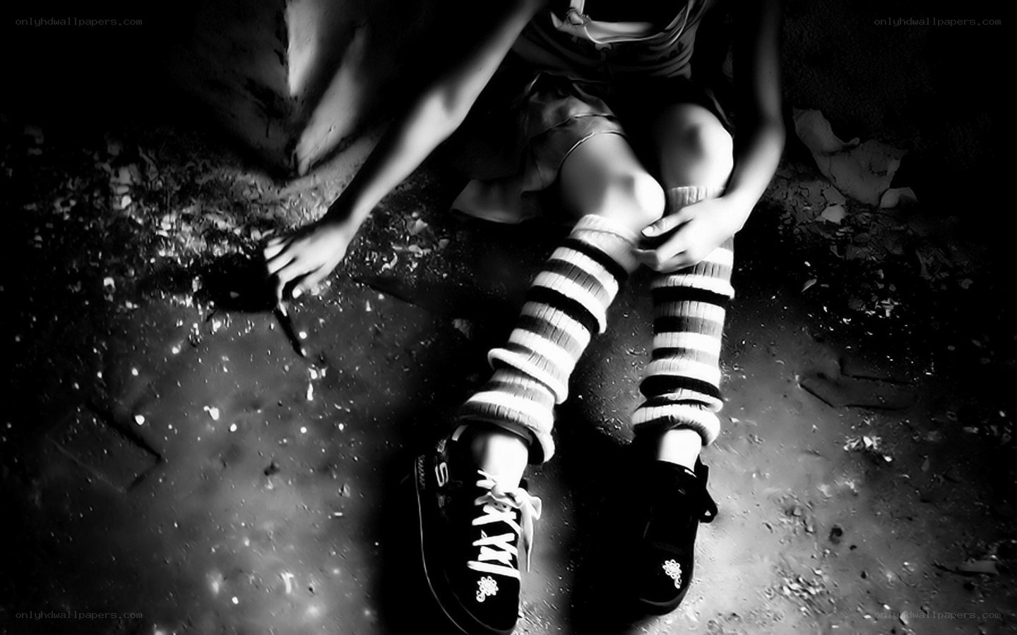 child sitting on ground