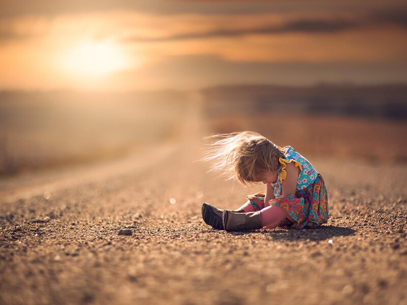 Child Sitting on Road — Brown, Serene, Sunset