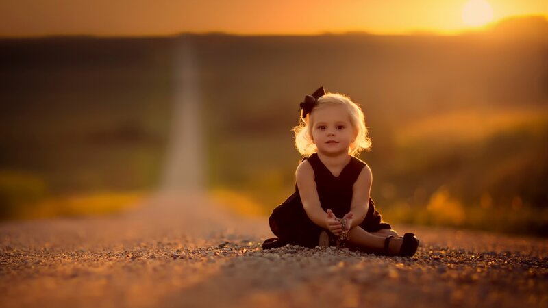 Child Sitting on Road — Orange, Serene