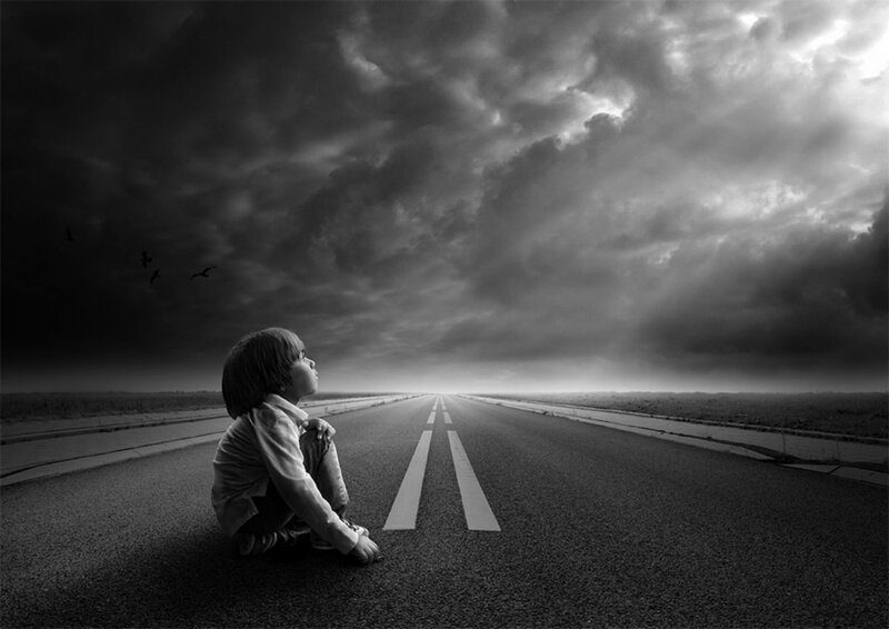 Child Sitting on Road