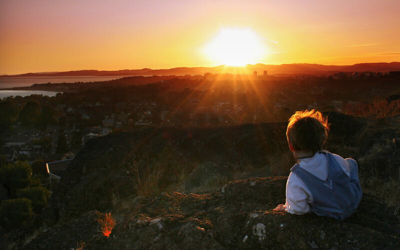 Child Sitting on Rock