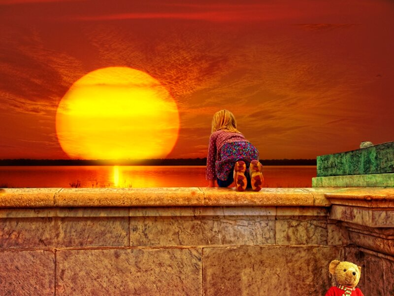 Child Sitting on Wall