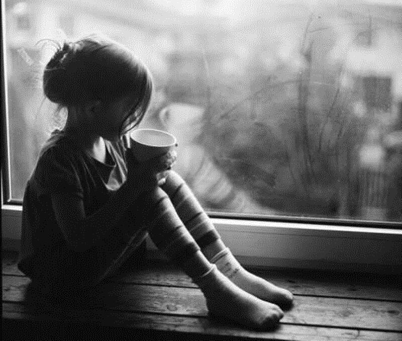 Child Sitting on Windowsill — Black