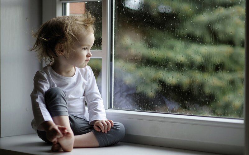 Child Sitting on Windowsill — White, Melancholic, Morning