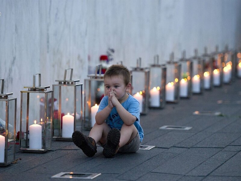 Child Sitting with Candles