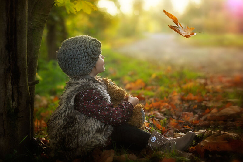 Child Sitting with Teddy Bear