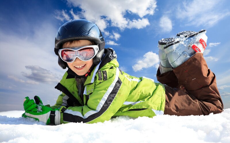 child skiing in snow