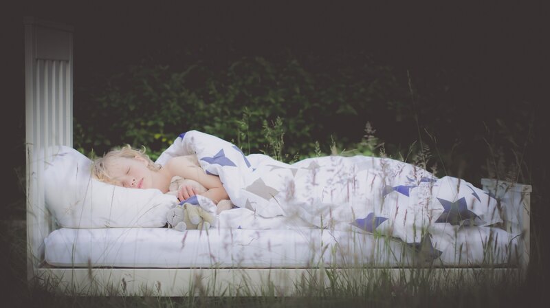 Child Sleeping in Bed — White, Serene