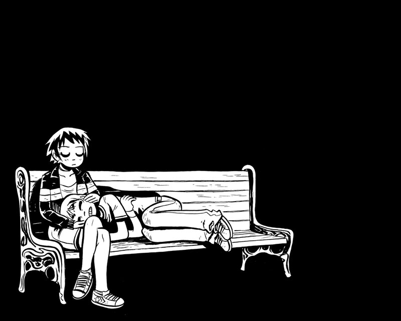 Child sleeping on a bench