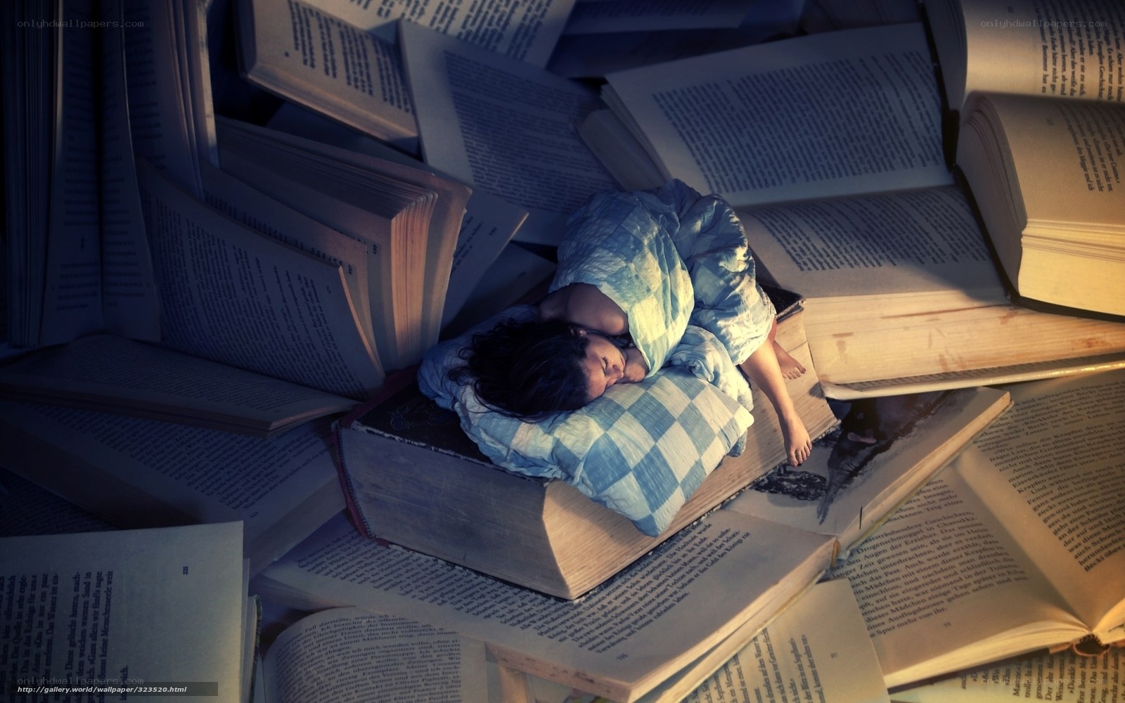 child sleeping on books