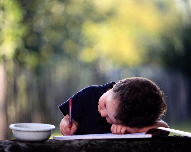 child sleeping on homework