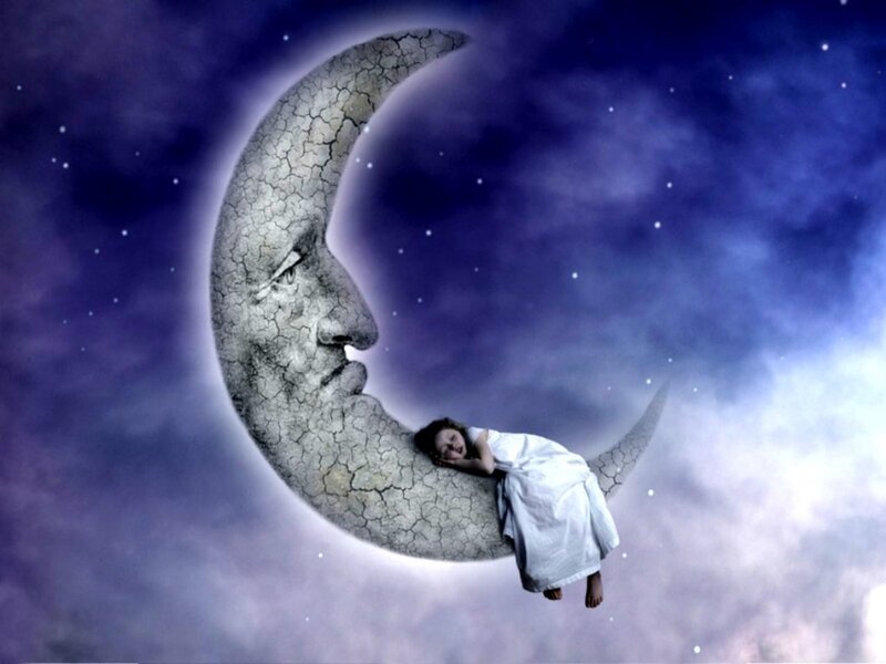 child sleeping on moon