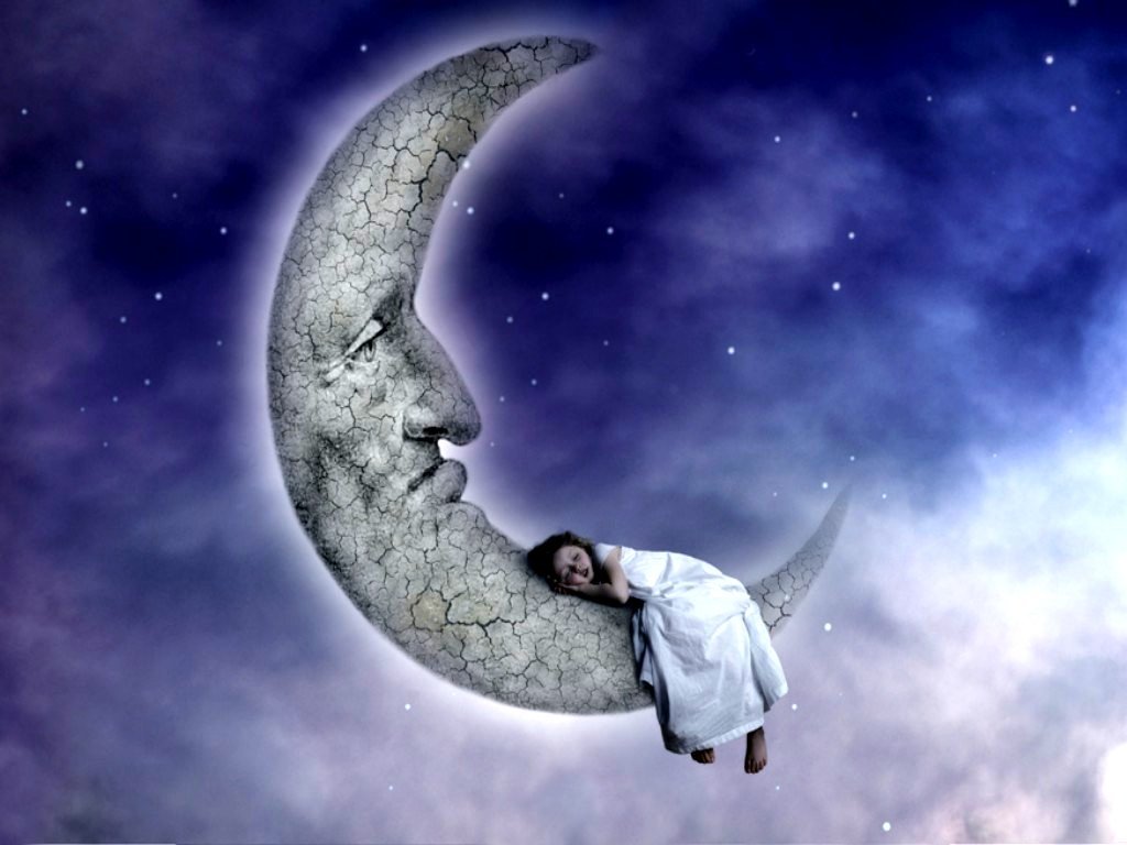 child sleeping on moon