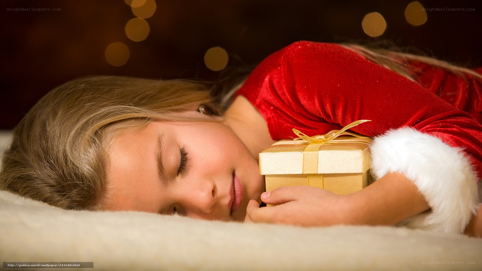 child sleeping with gift