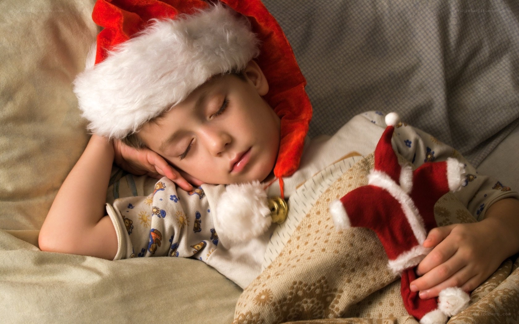 child sleeping with santa hat