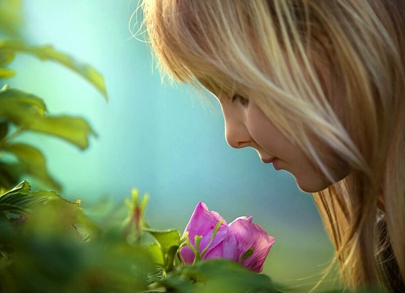 Child Smelling Flower — Pink, Serene