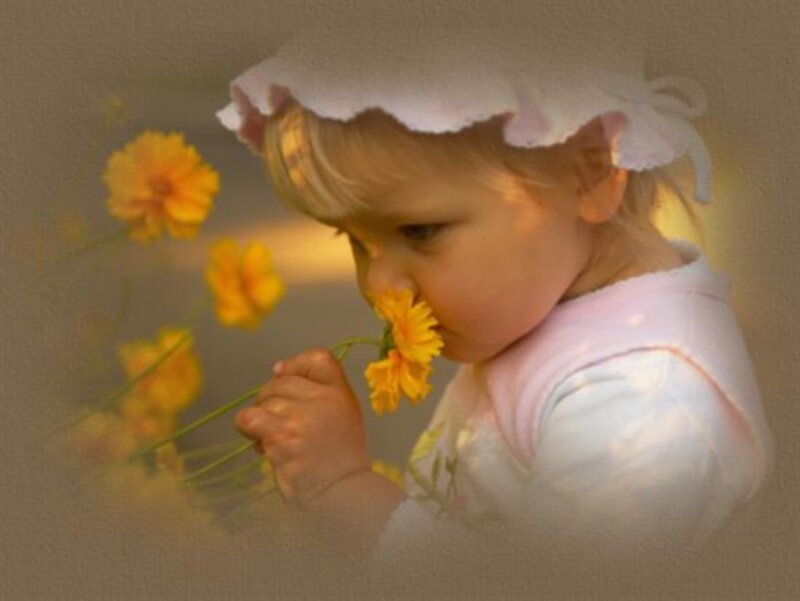 Child Smelling Flower
