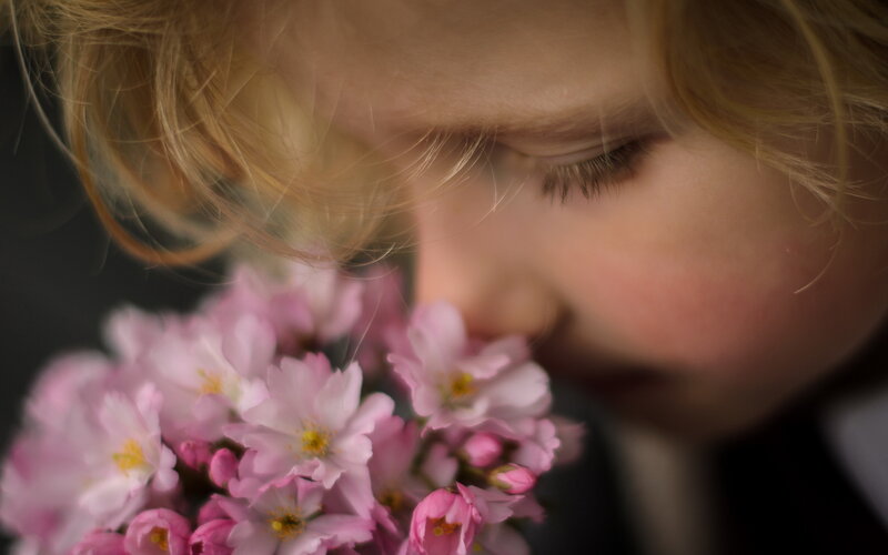 Child Smelling Flowers — Pink