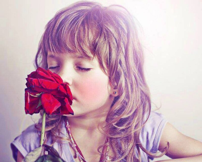 Child Smelling Rose — Red
