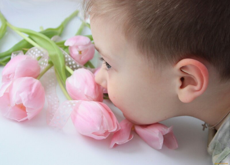 Child Smelling Tulips