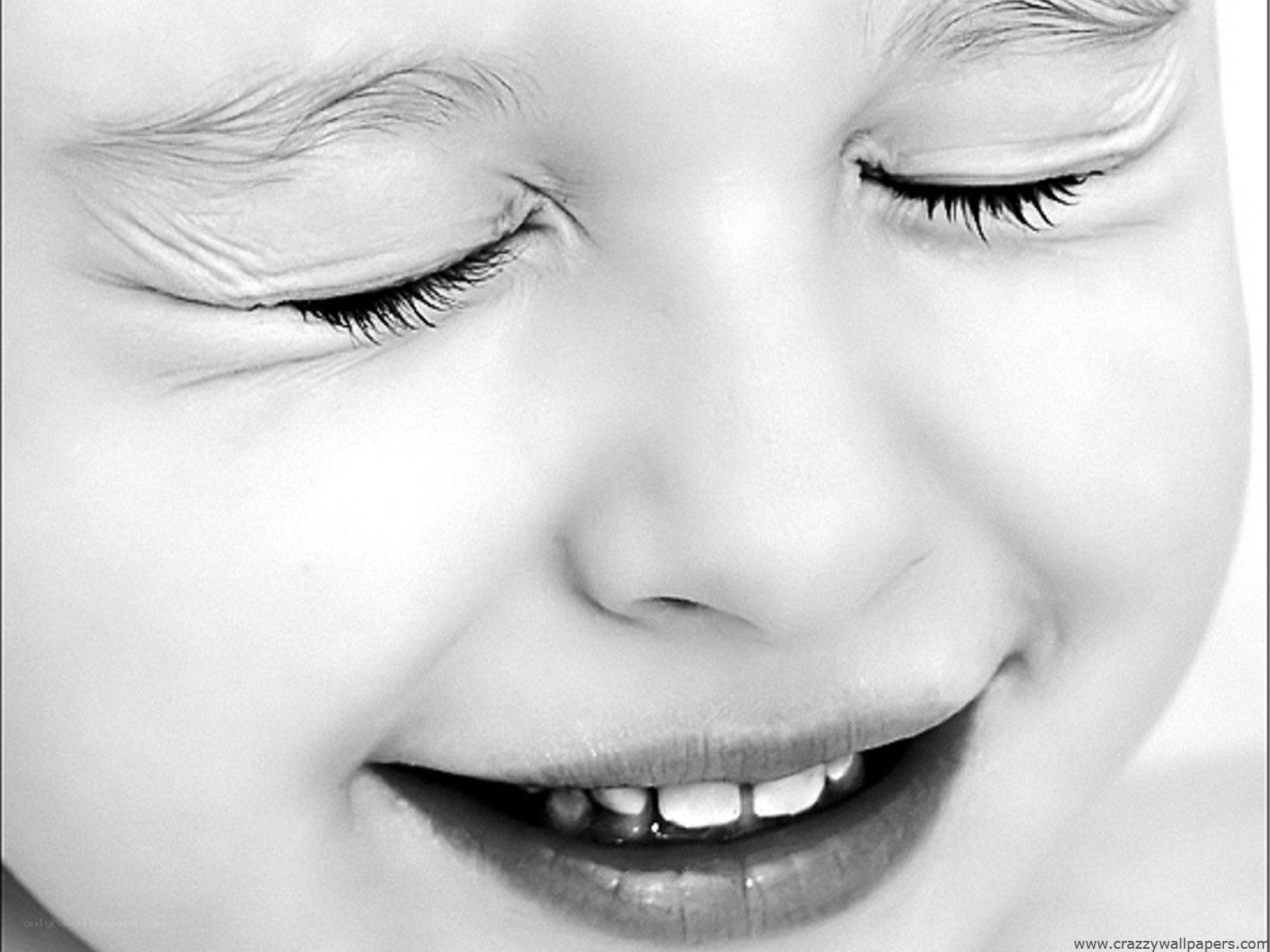 child smiling with closed eyes