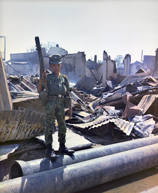 Child soldier in war-torn area