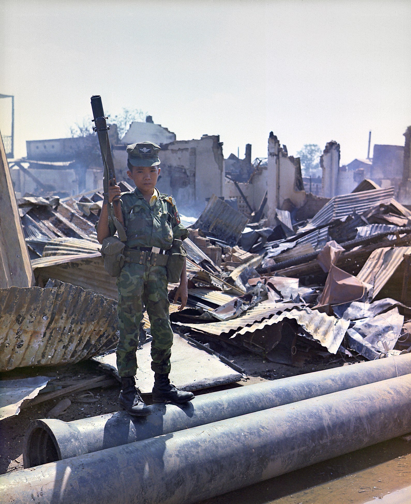 Child soldier in war-torn area