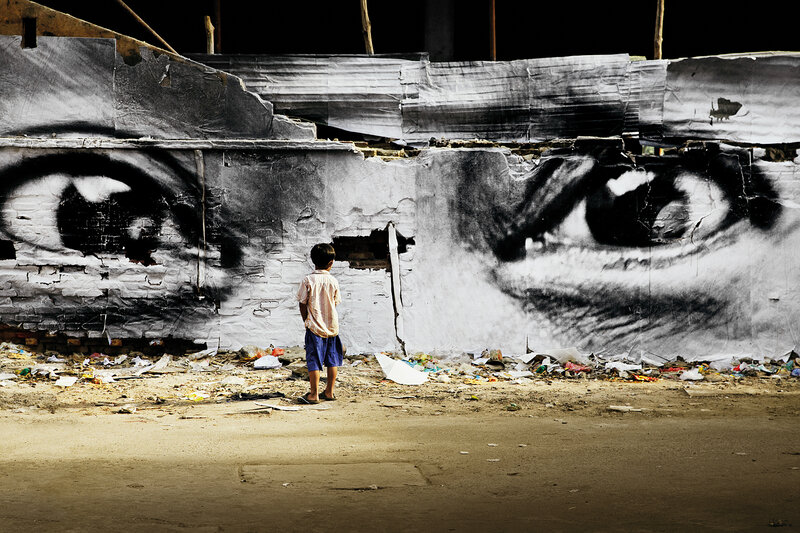 Child Standing Before Mural