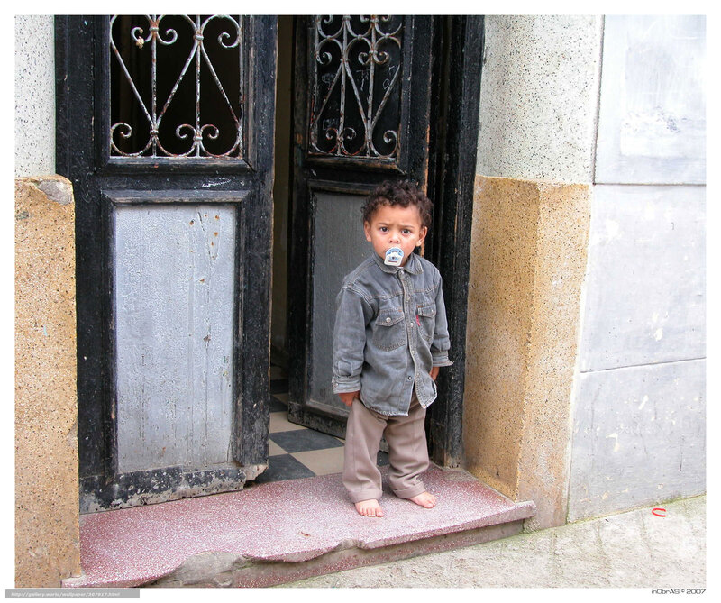 child standing in doorway