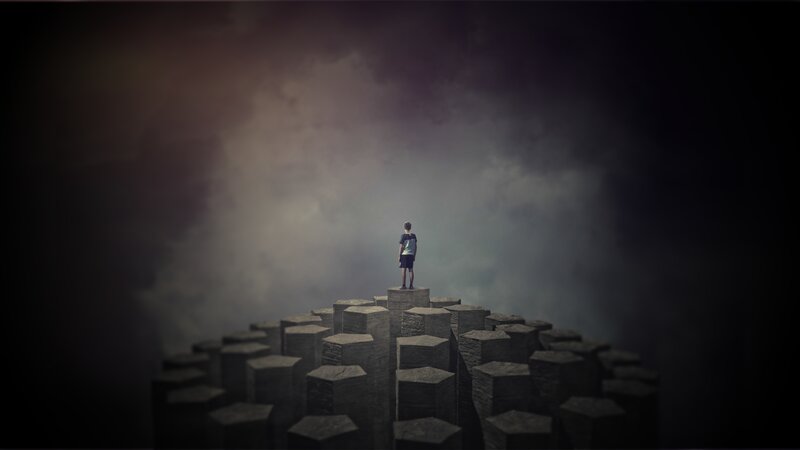 Child Standing on Stone Pillars
