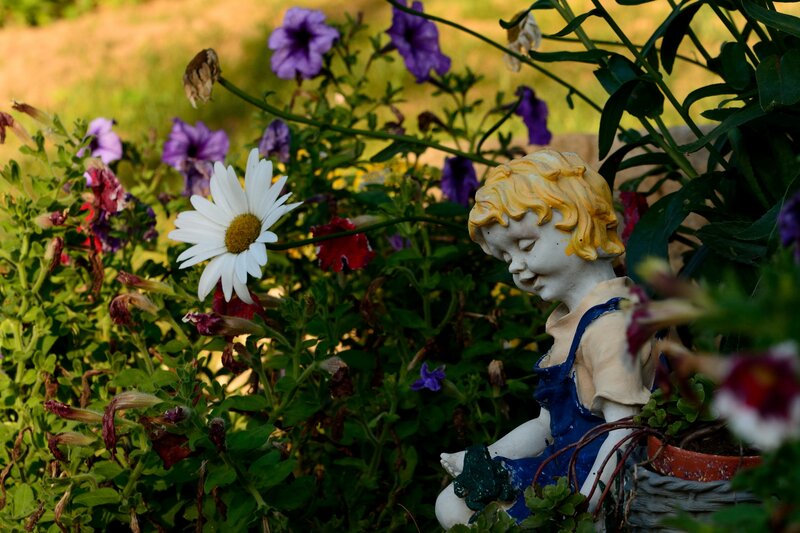 Child Statue in Garden — Green