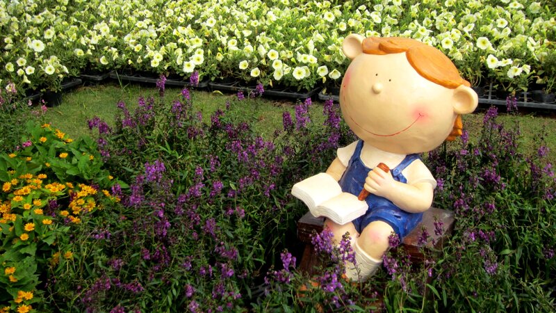 Child Statue in Garden