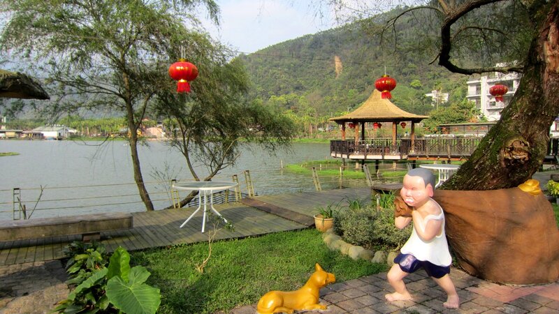 Child Statue Near Lake